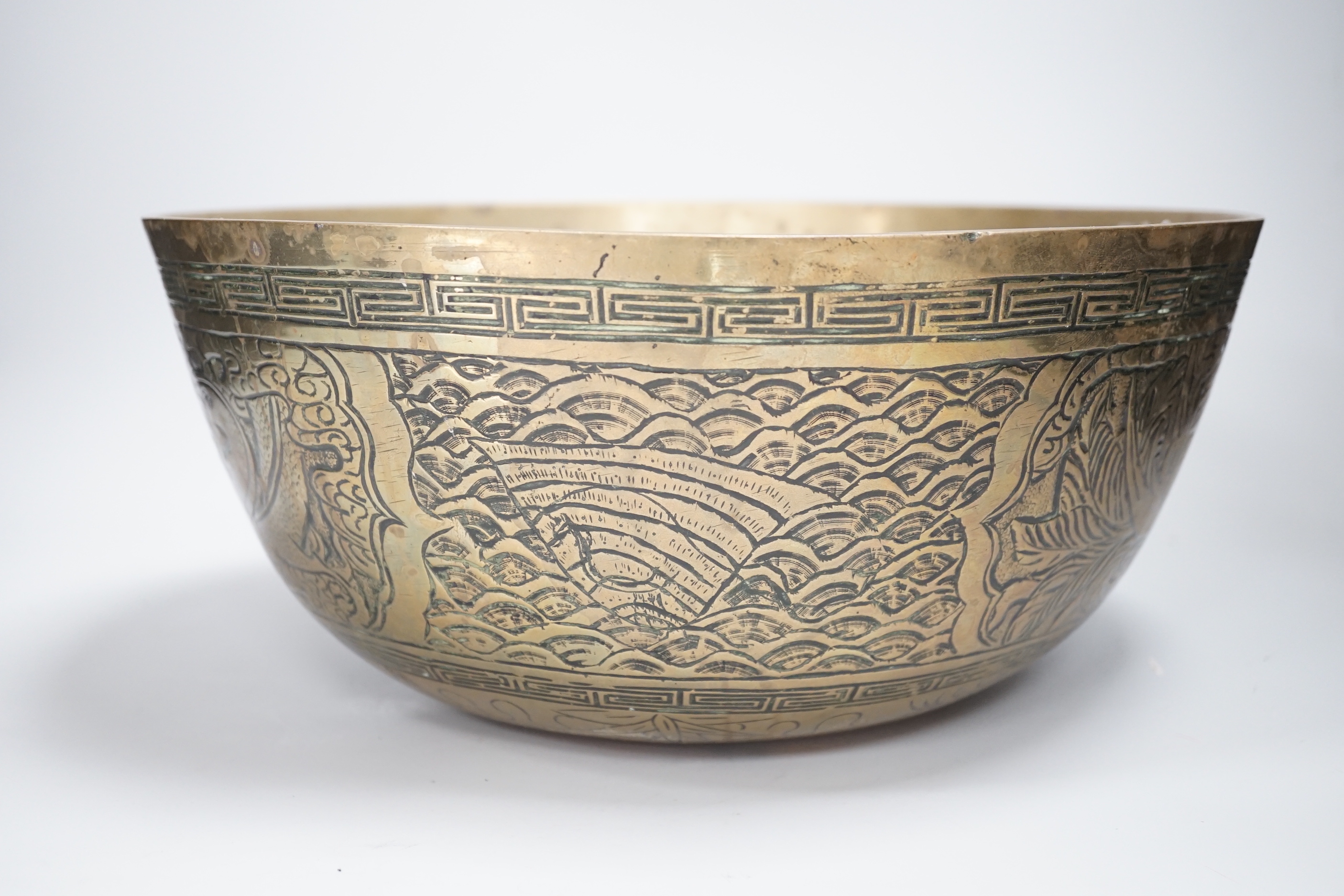 A Chinese brass ‘dragon’ engraved bowl, early 20th century, 33cm diameter